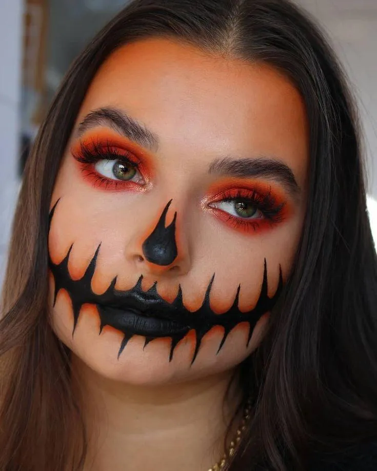 Woman with Pumpkin Makeup at Halloween Festival image