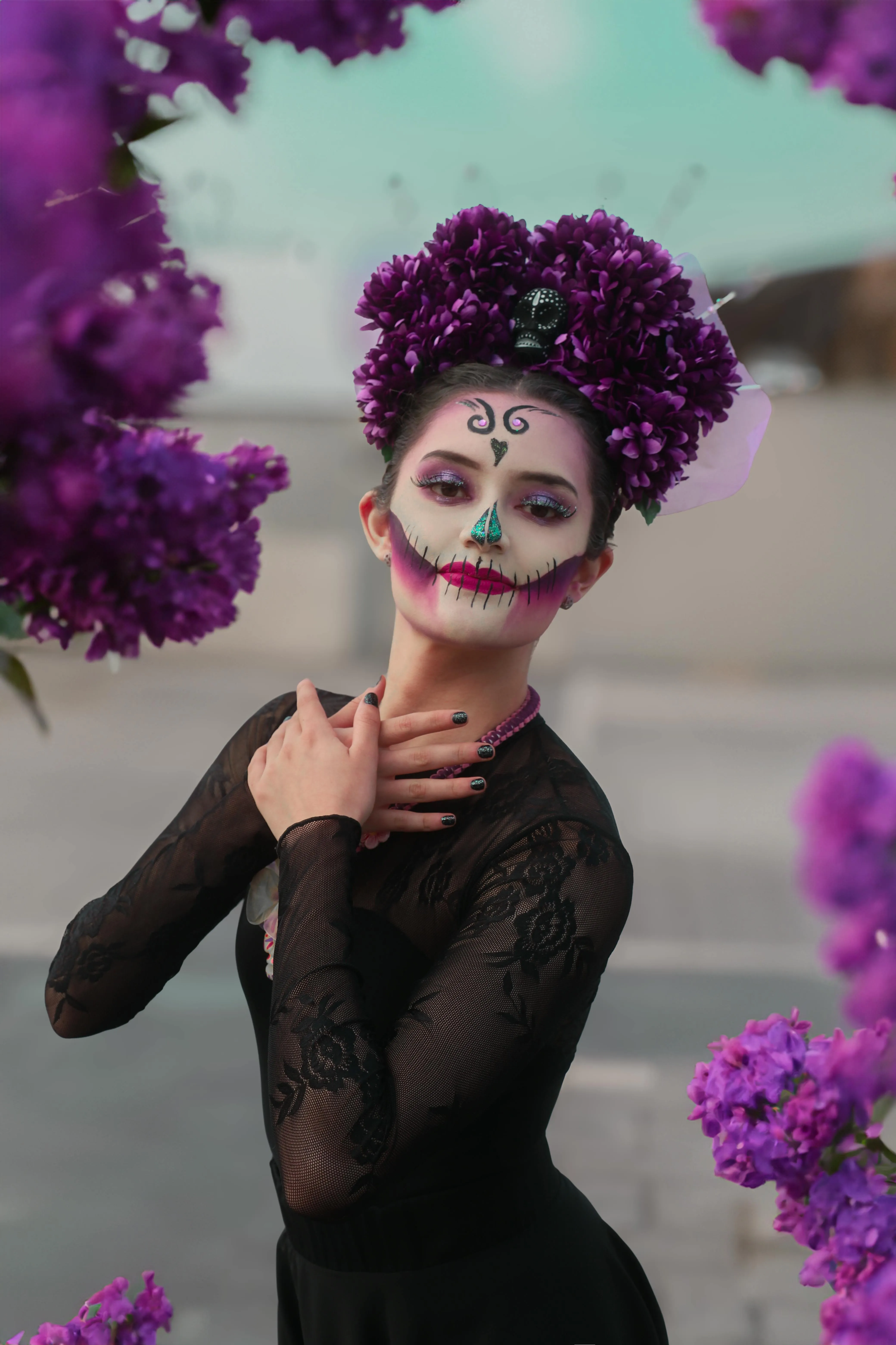 Woman with Purple Floral Headpiece and Face Paint Wallpaper
