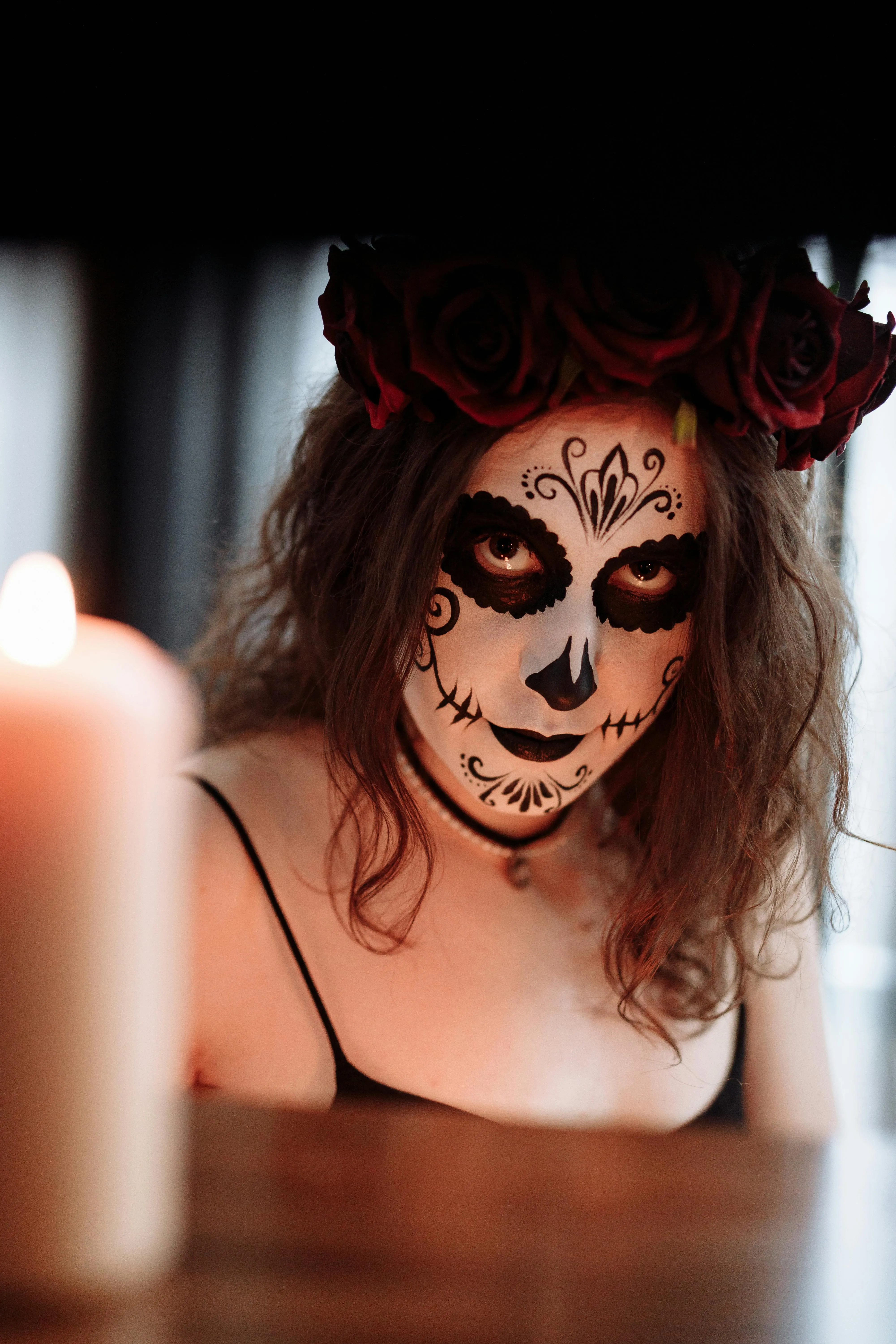 Woman with Rose Crown and Candlelight for Halloween image