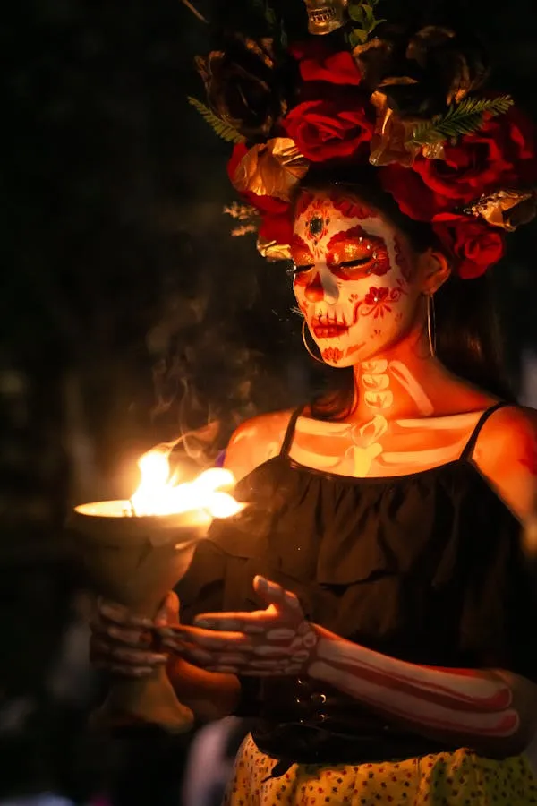Woman with skull face paint performing with fire image