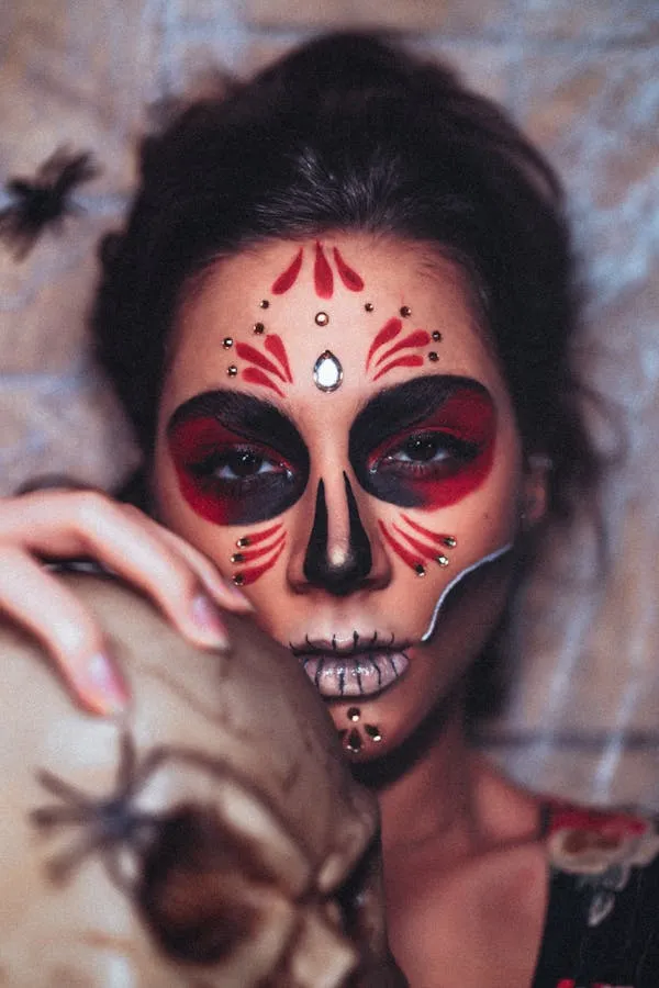 Woman with skull makeup and decorative face painting image