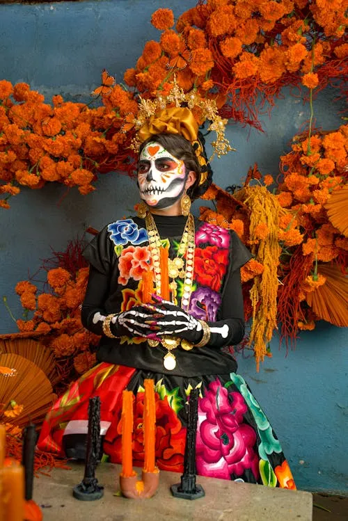 Woman with Sugar Skull Makeup and Bright Floral Headpiece