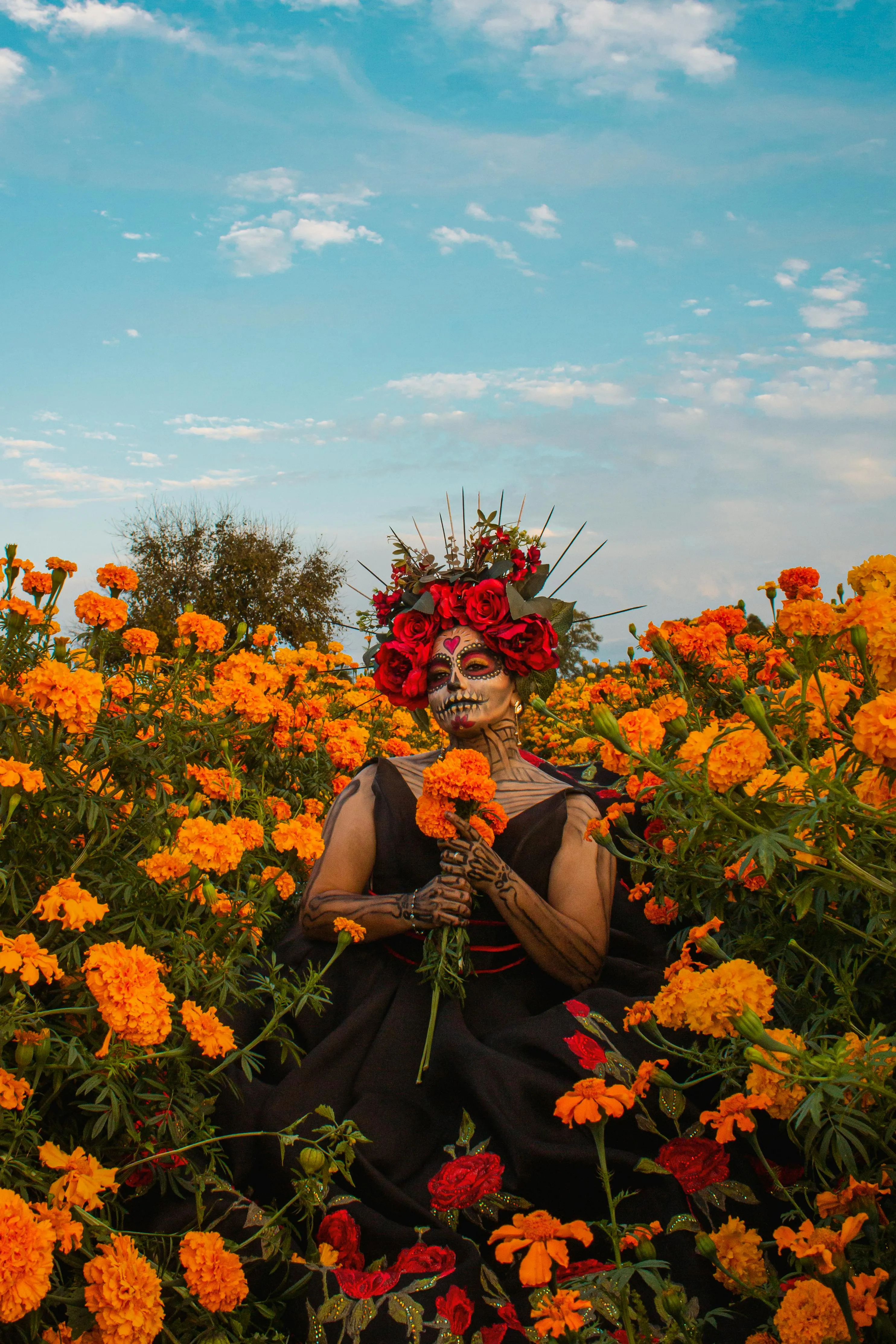 Women in a Beautiful Flower Field Taking Halloween Photo