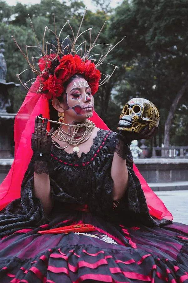 Women in Black Traditional Costume holding a Skull image