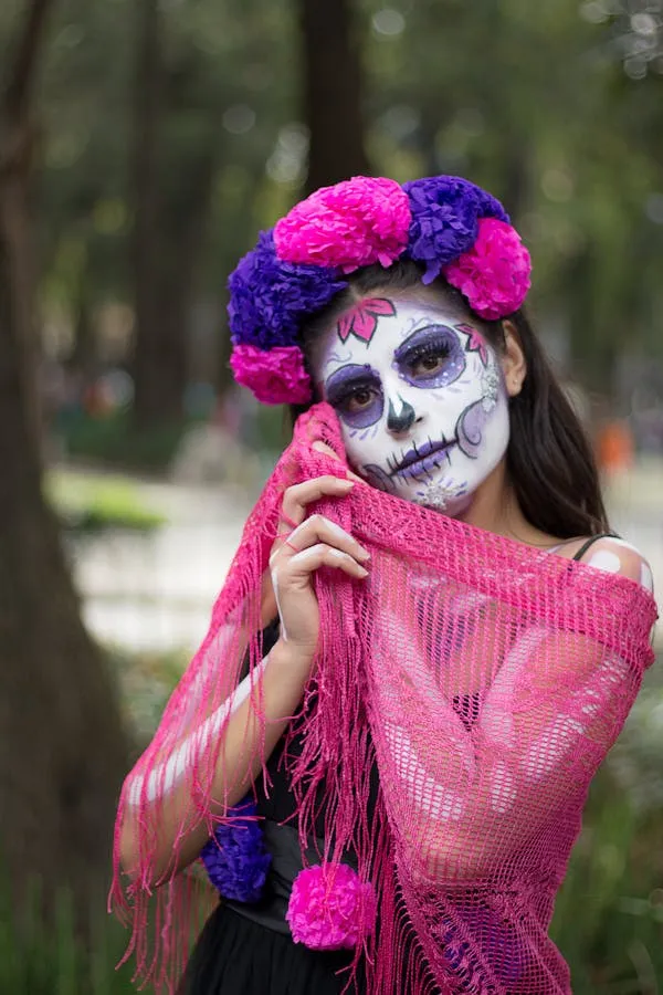 Women in Pink Skull Makeup with Floral Headpiece Wallpaper