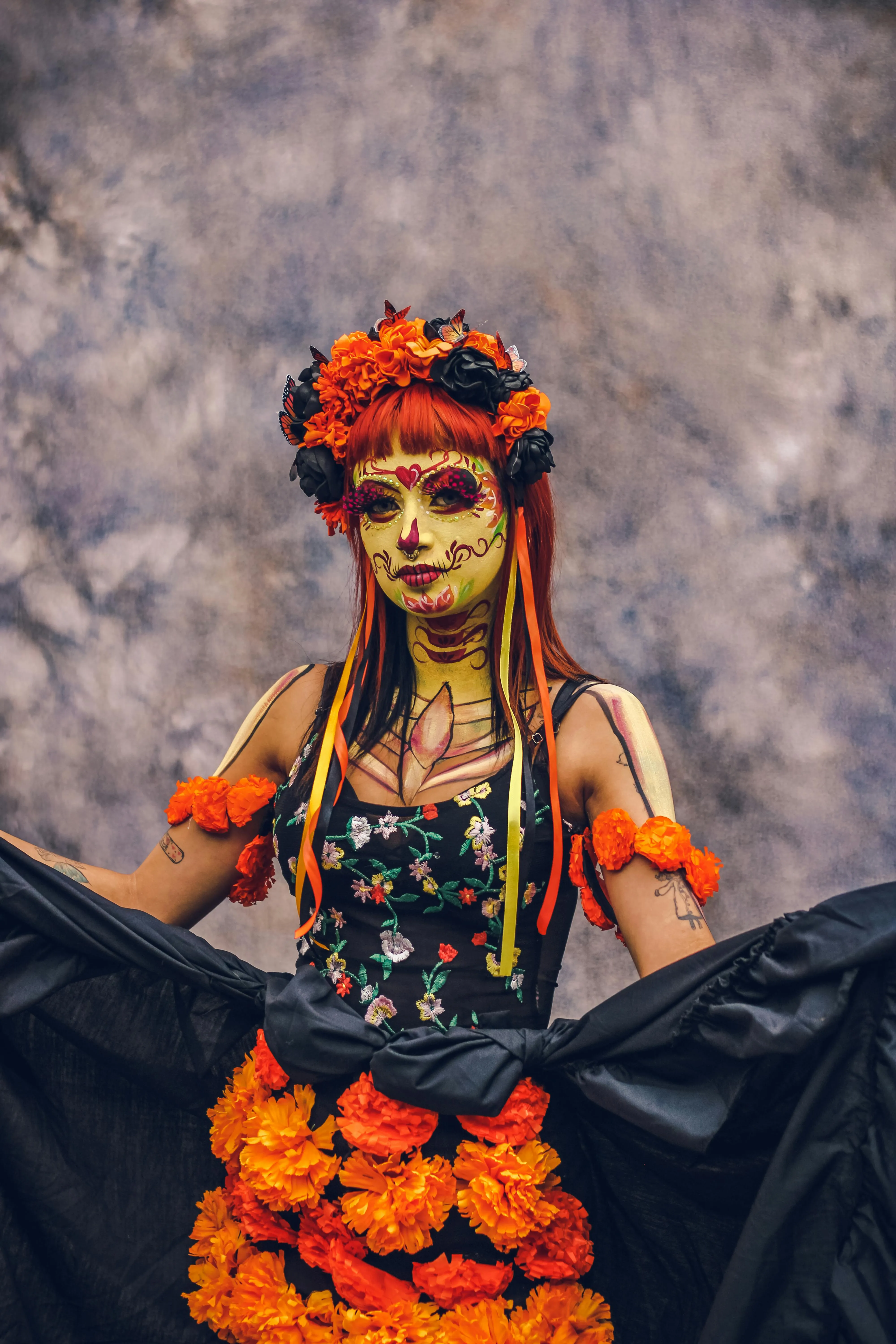 Women in Vibrant Halloween Festival Makeup with Floral Crown