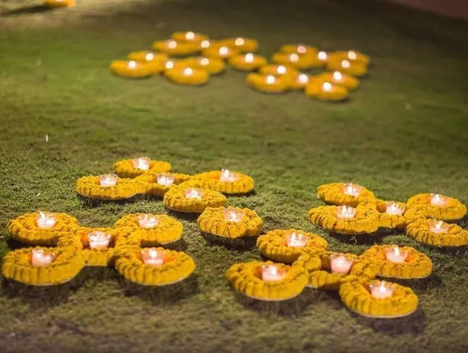 Yellow flower candle decoration ideas for festival image