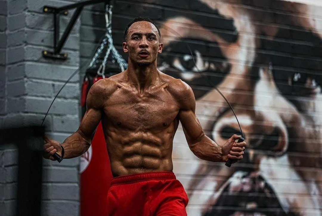 Athletic Man Jumping Rope in Front of an Urban Graffiti Wall