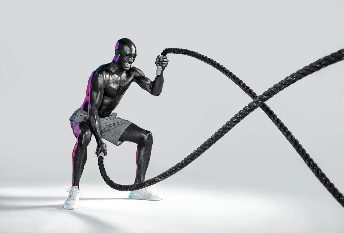 Athletic Man Training With Battle Ropes Hd Free Wallpaper