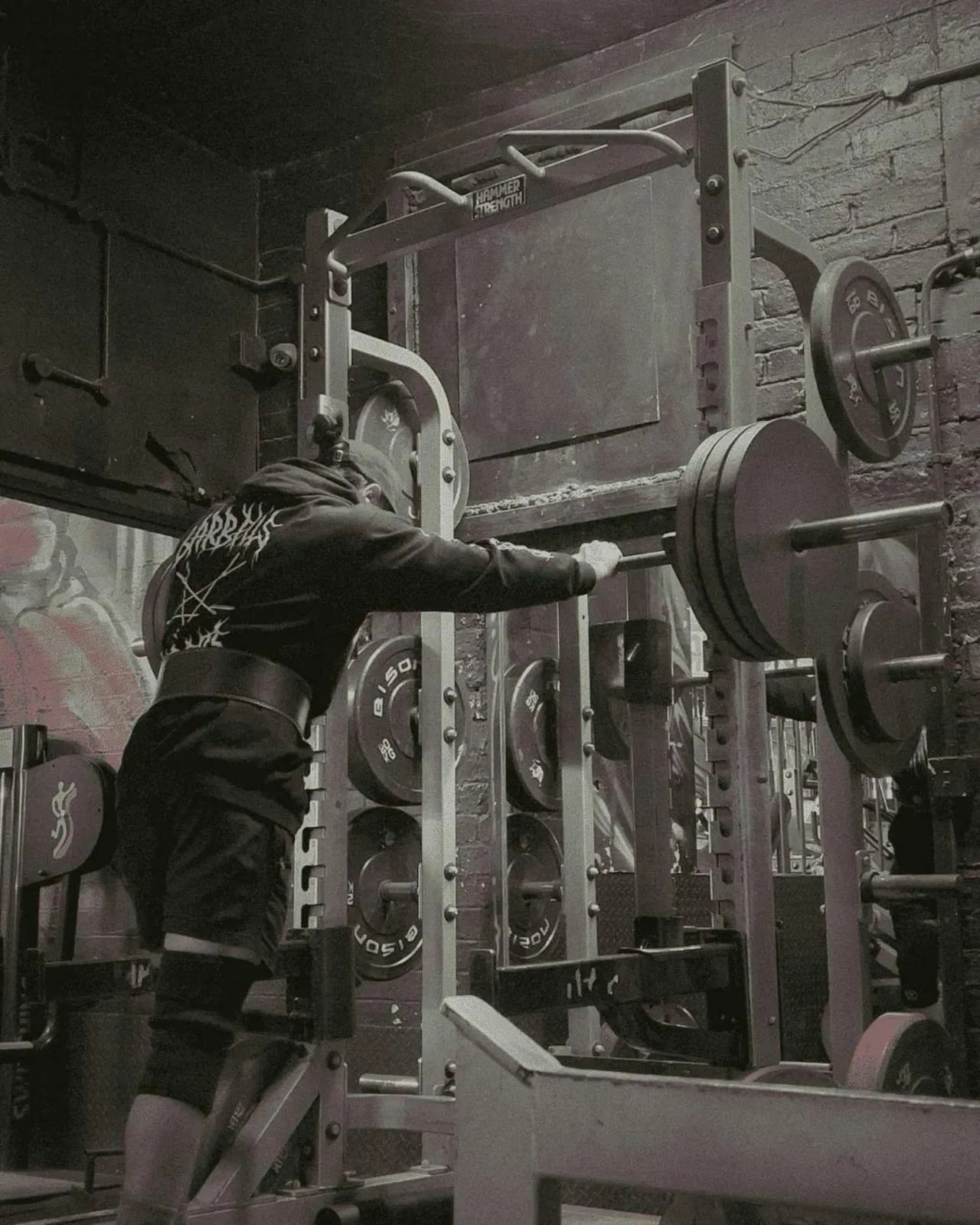 Black and White Gym Scene With a Woman Lifting Weights