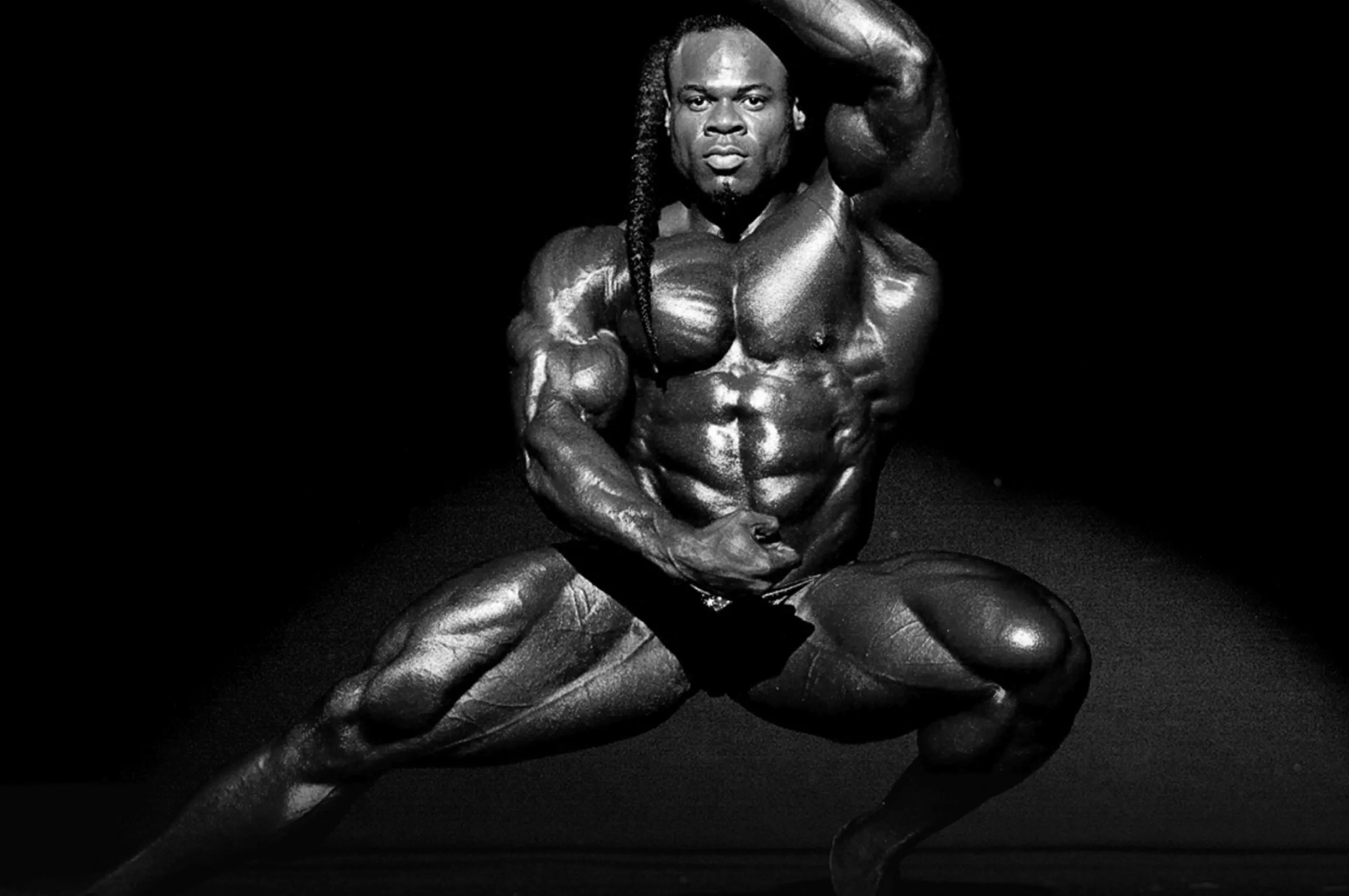 Black and White Photo of Kai Greene in a Bodybuilder Pose