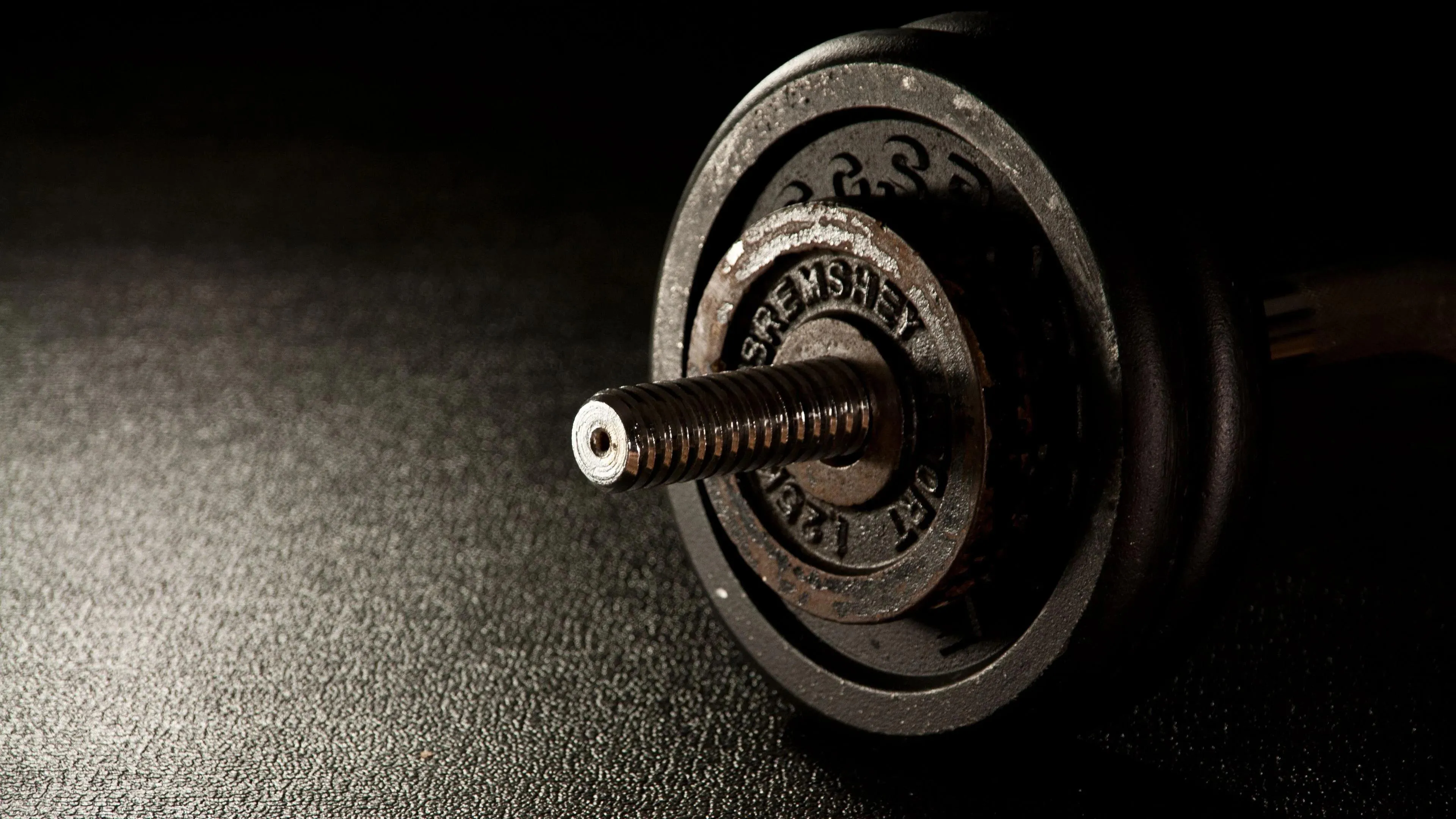 Close Up Shot of Weight Plates on a Barbell Free Wallpaper