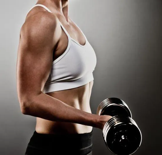Close Up of a Woman Holding a Dumbbell Lifting Weights