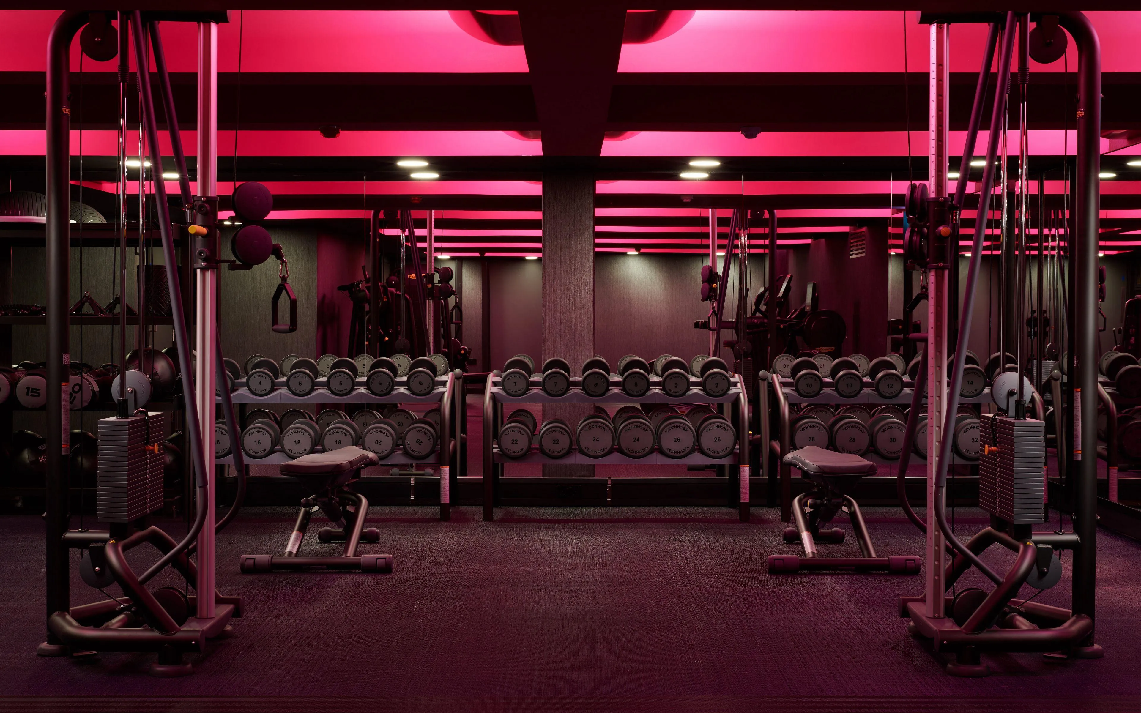 Empty Gym With Weight Machines Ready For Training Wallpaper