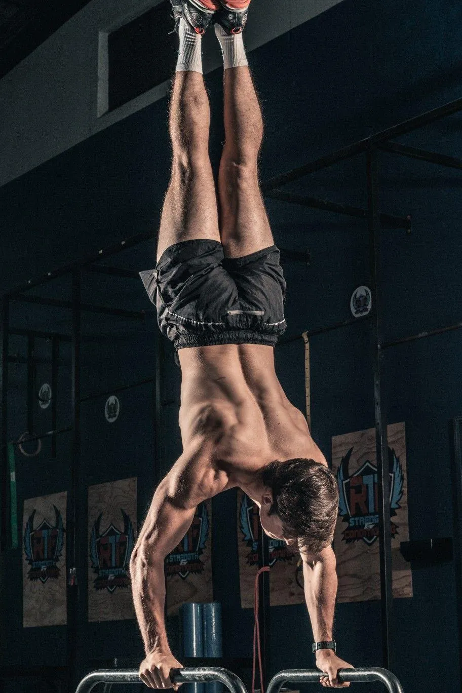 Man Doing Handstand Pushups in a Challenging Workout
