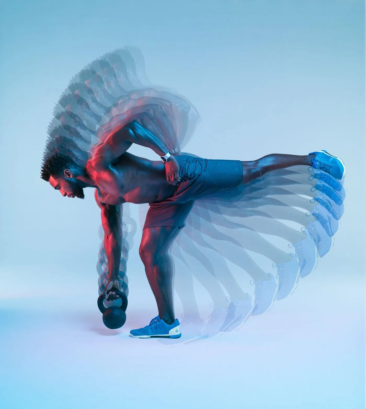 Man Doing Kettlebell Swings With a Motion Blur Effect in Gym