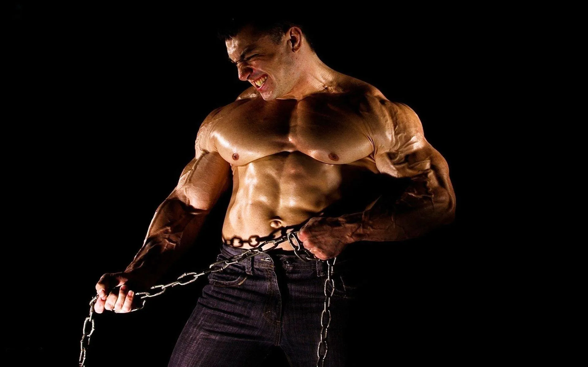 Man Flexing Right Arm Showing Vascular Bicep Veins Wallpaper