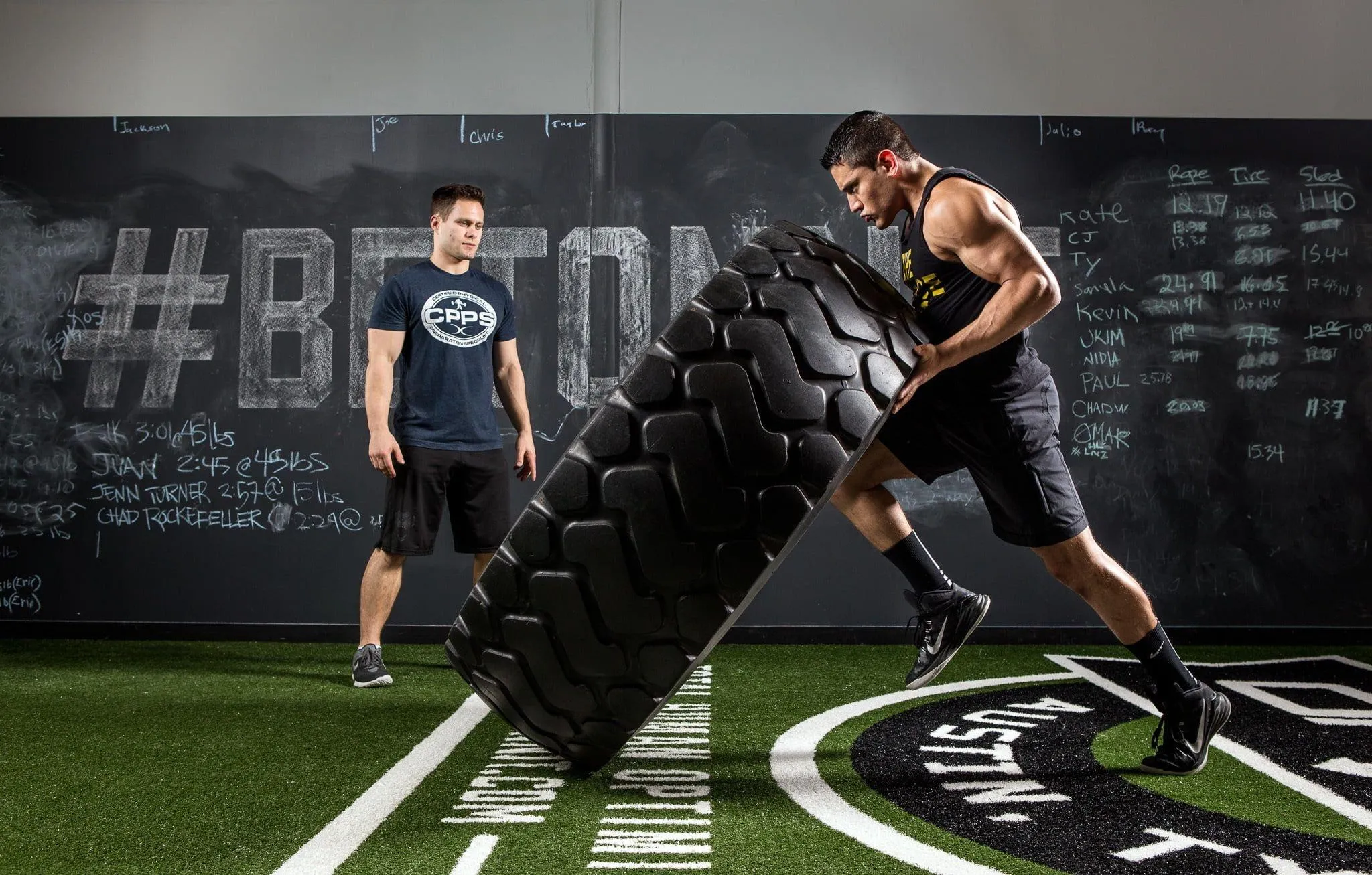 Man Flipping Large Tire in Outdoor Strength Free Wallpaper