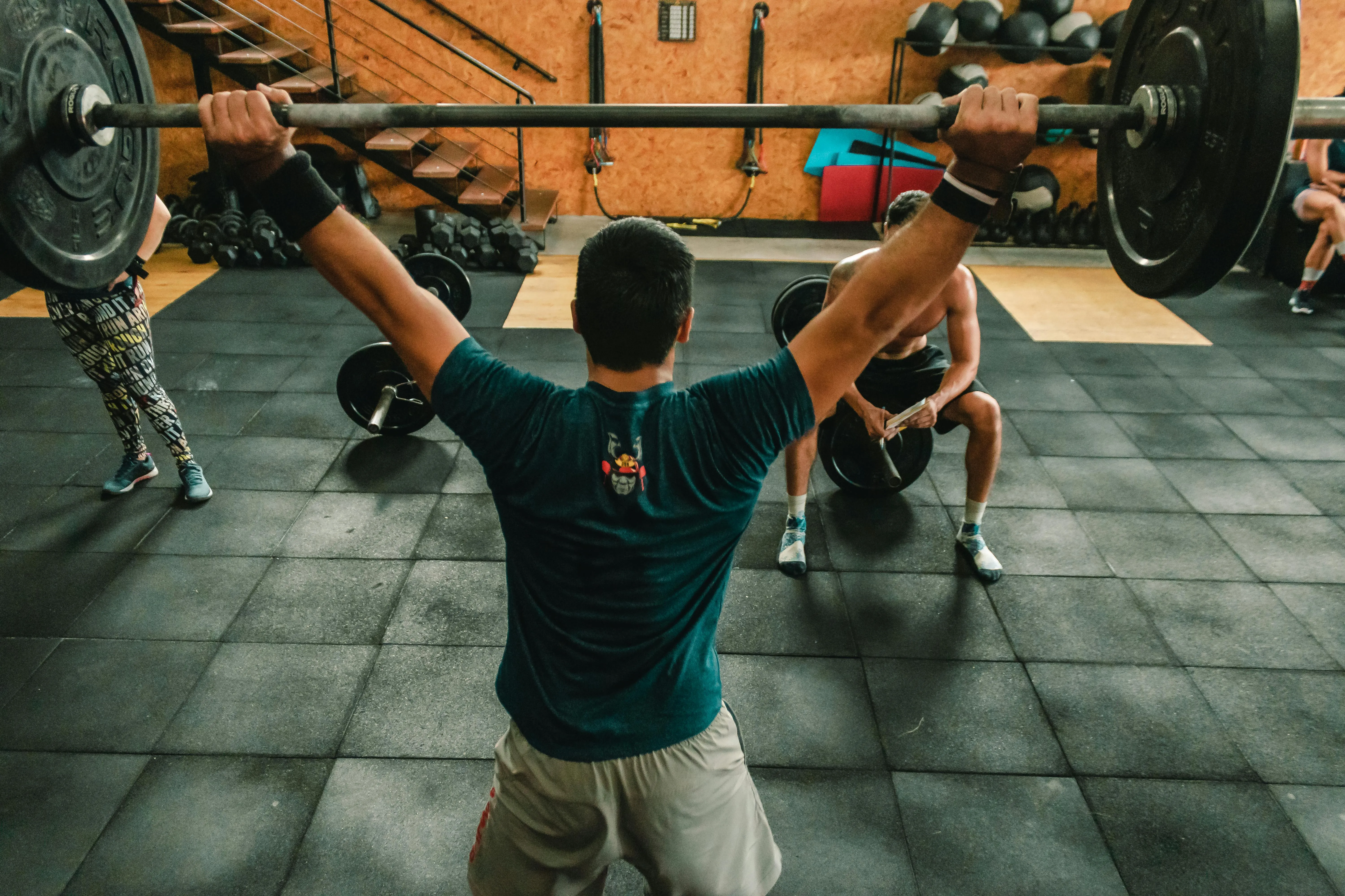 Man Lifting Heavy Barbell During a Powerlifting Event