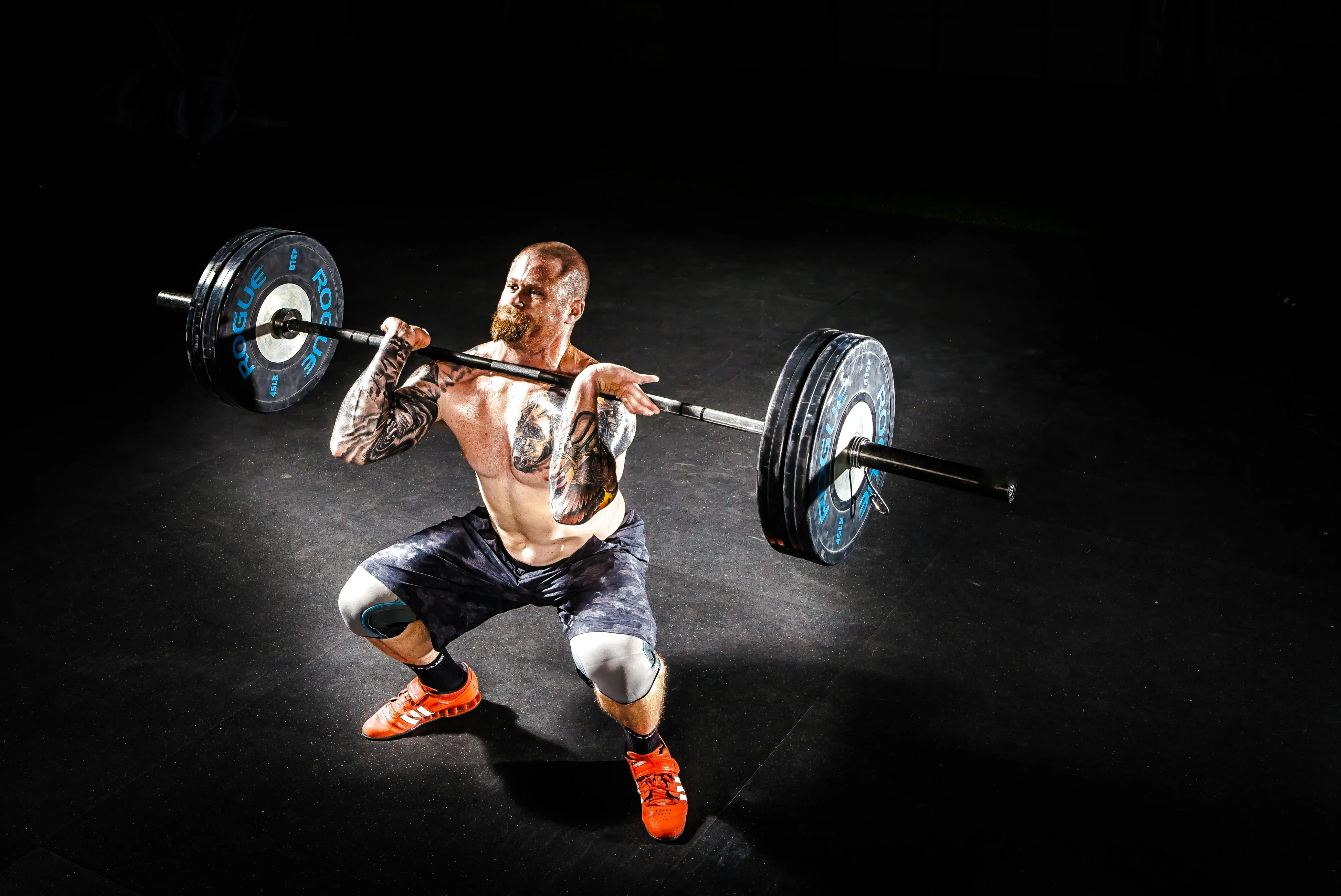 Man Performing Clean and Jerk To Build Explosive Power