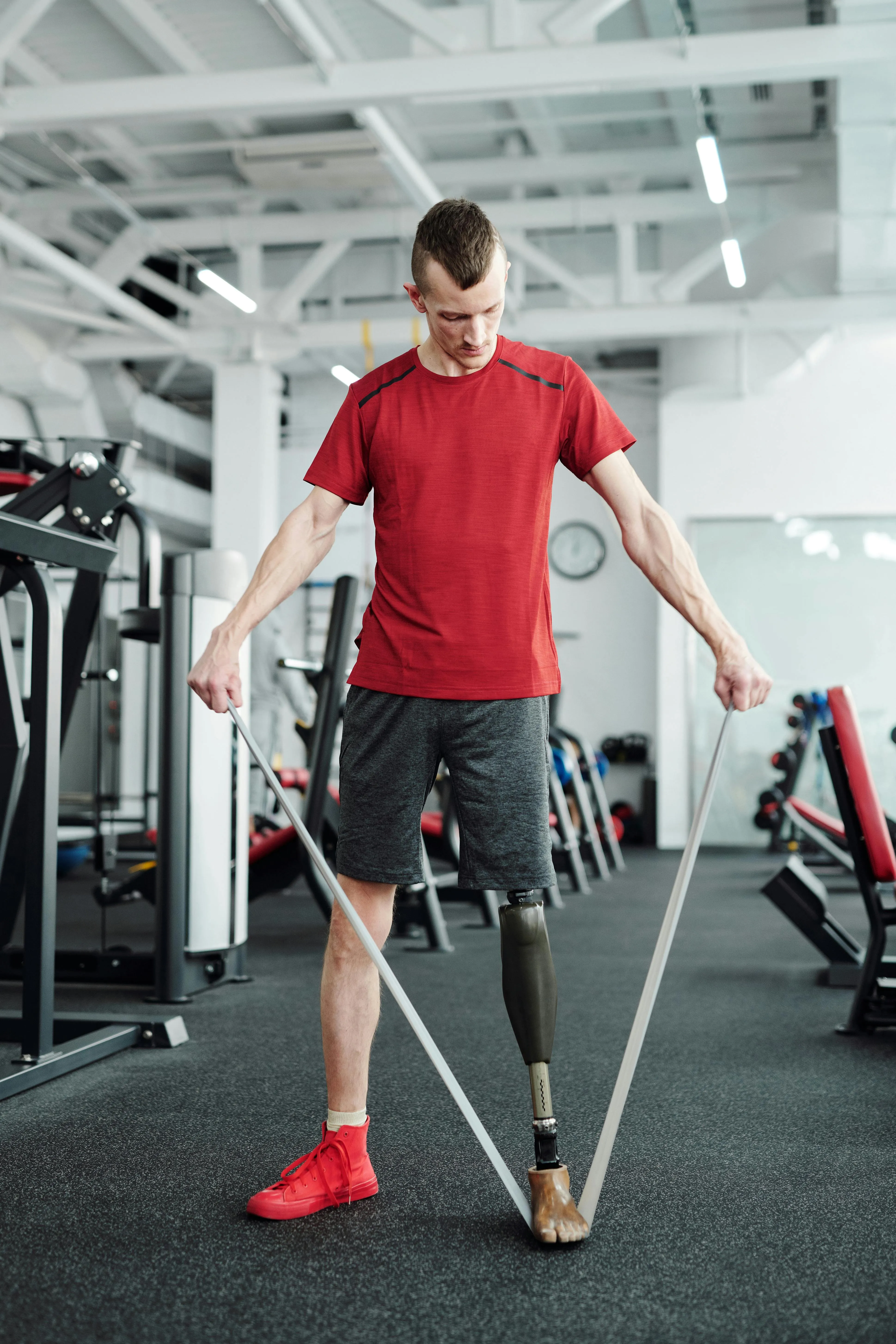 Man Performing a Resistance Band Workout in a Gym Wallpaper