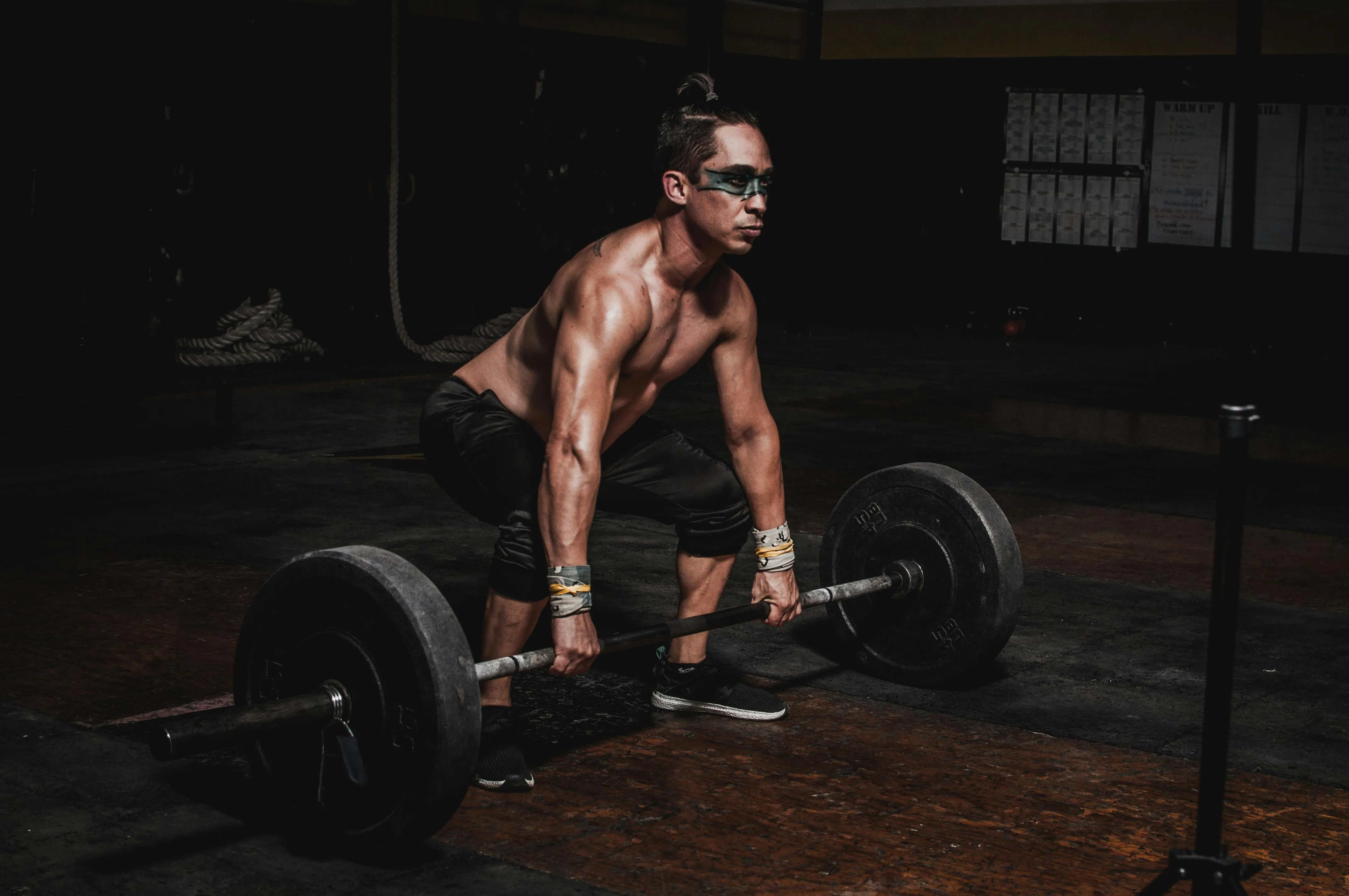 Man Preparing To Lift a Heavy Barbell During a Gym Workout