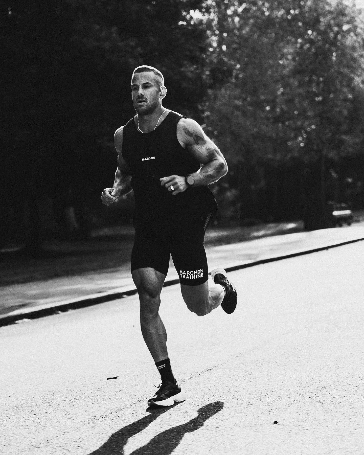 Man Running Outdoors on the Road During a Morning Workout