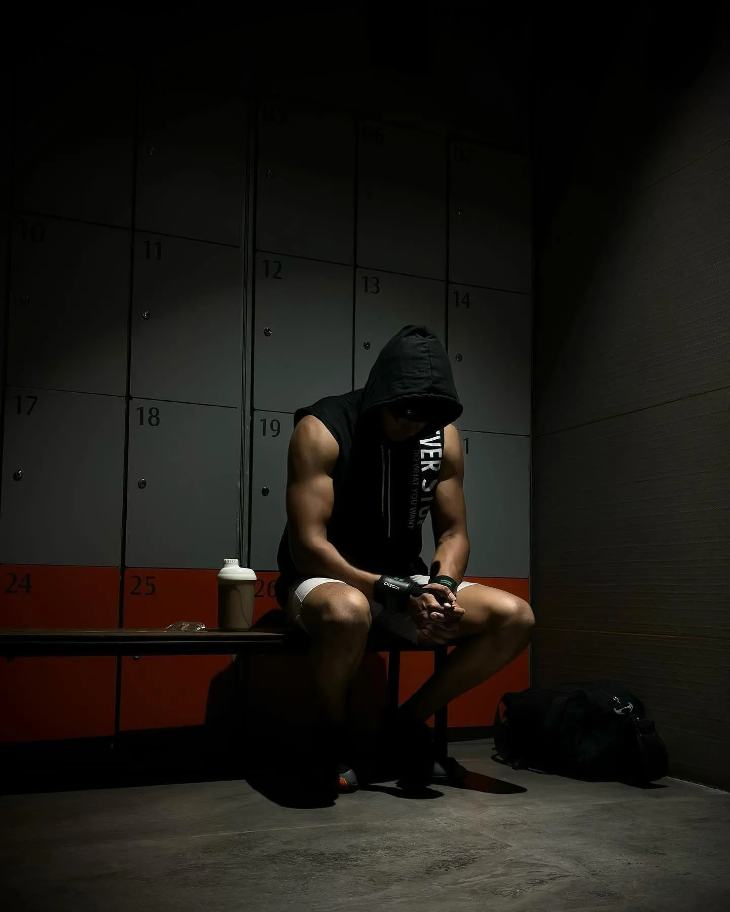 Man Sitting Alone in the Gym Looking Thoughtful and Focused