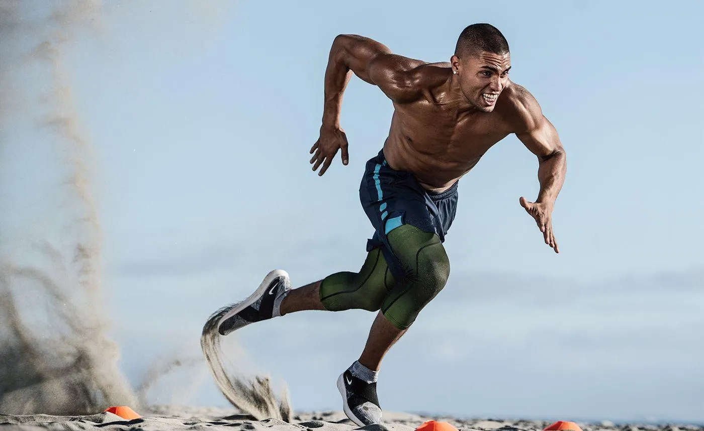 Man Sprinting on the Beach Shows Strength and Determination