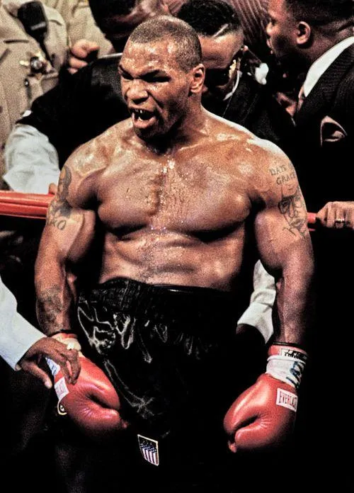 Mike Tyson Celebrating in the Ring Showing Intense Power
