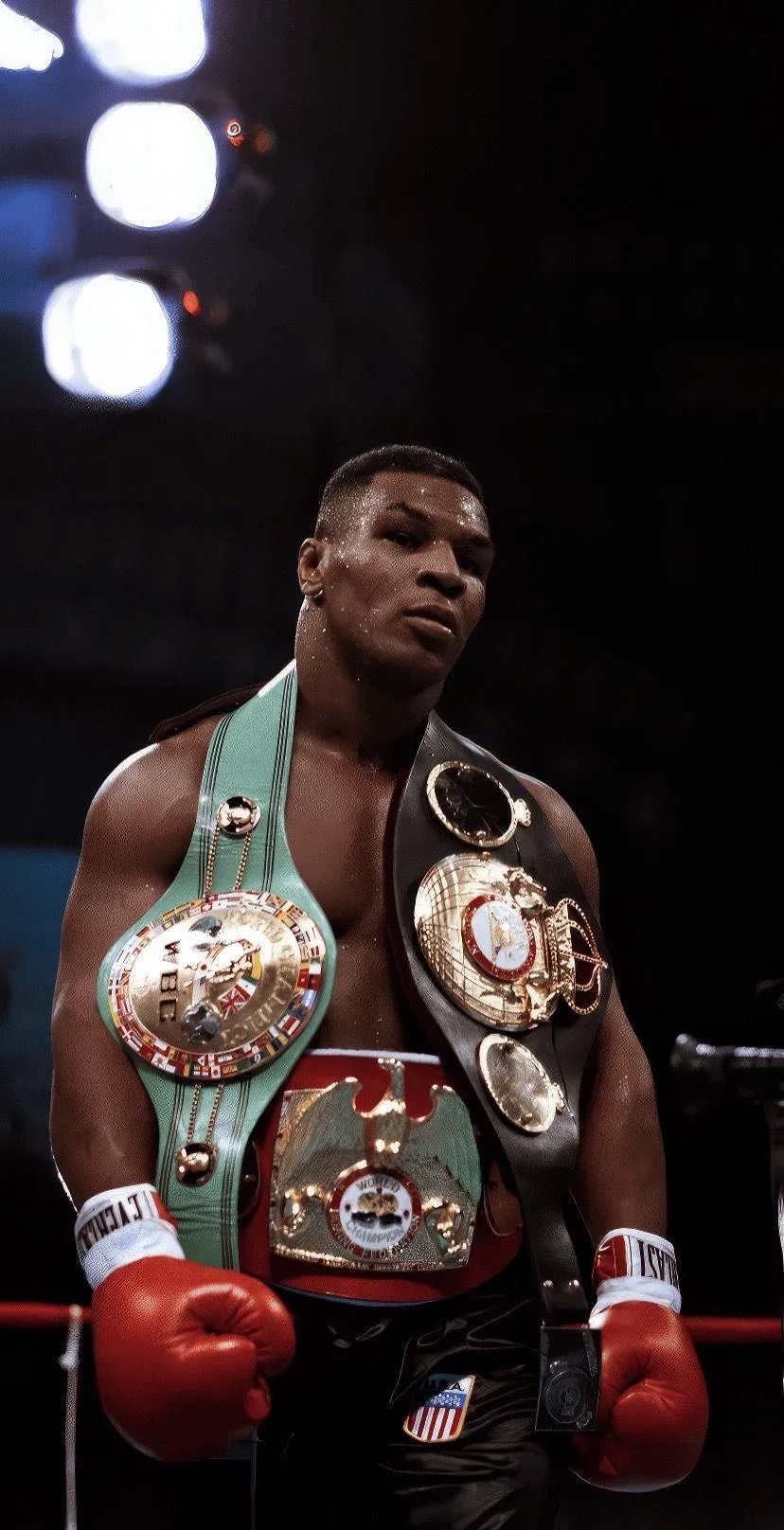 Mike Tyson Is Standing Proudly With Championship Belts