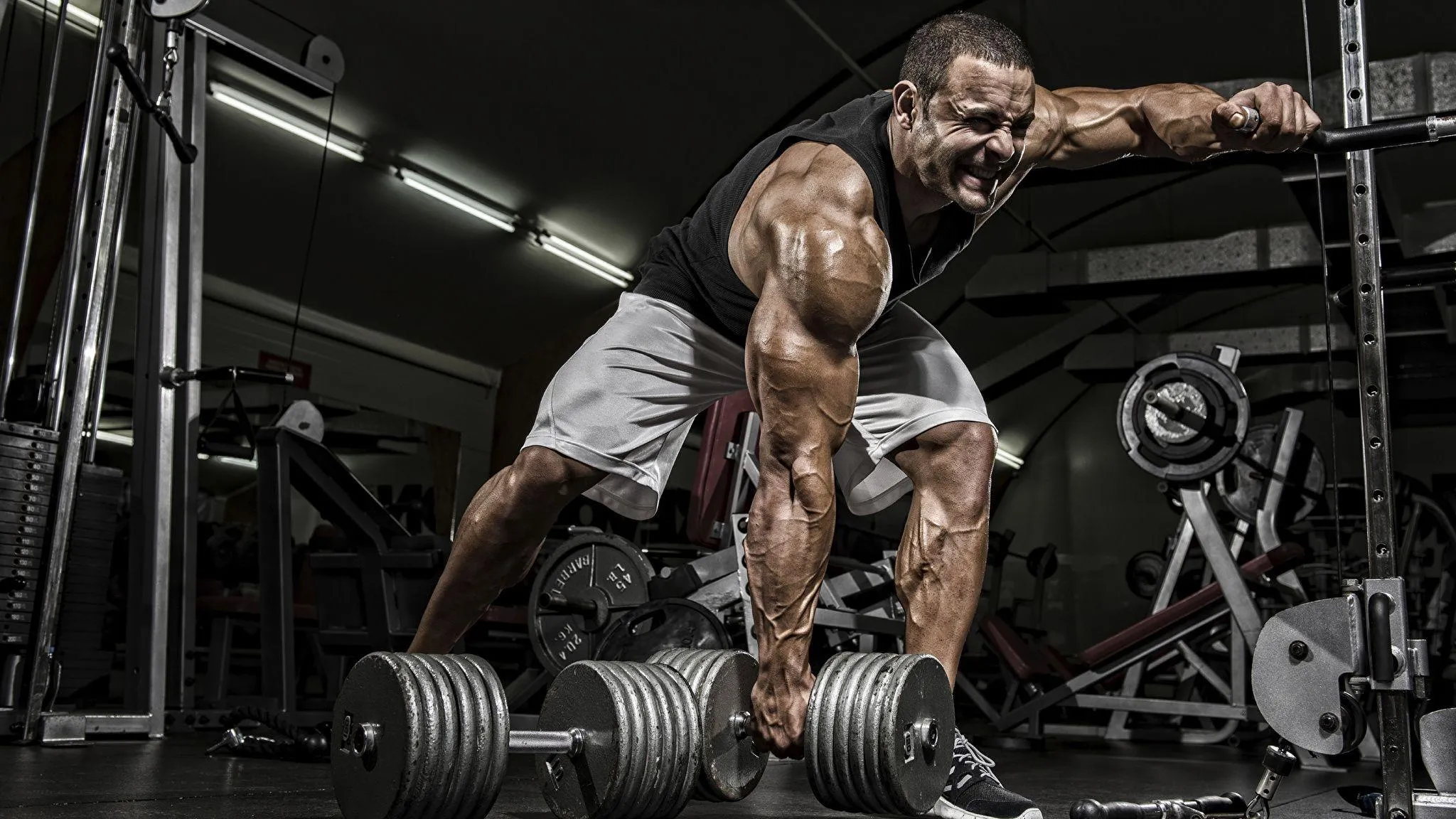 Muscular Man Doing Deadlift Exercise in a Gym Environment