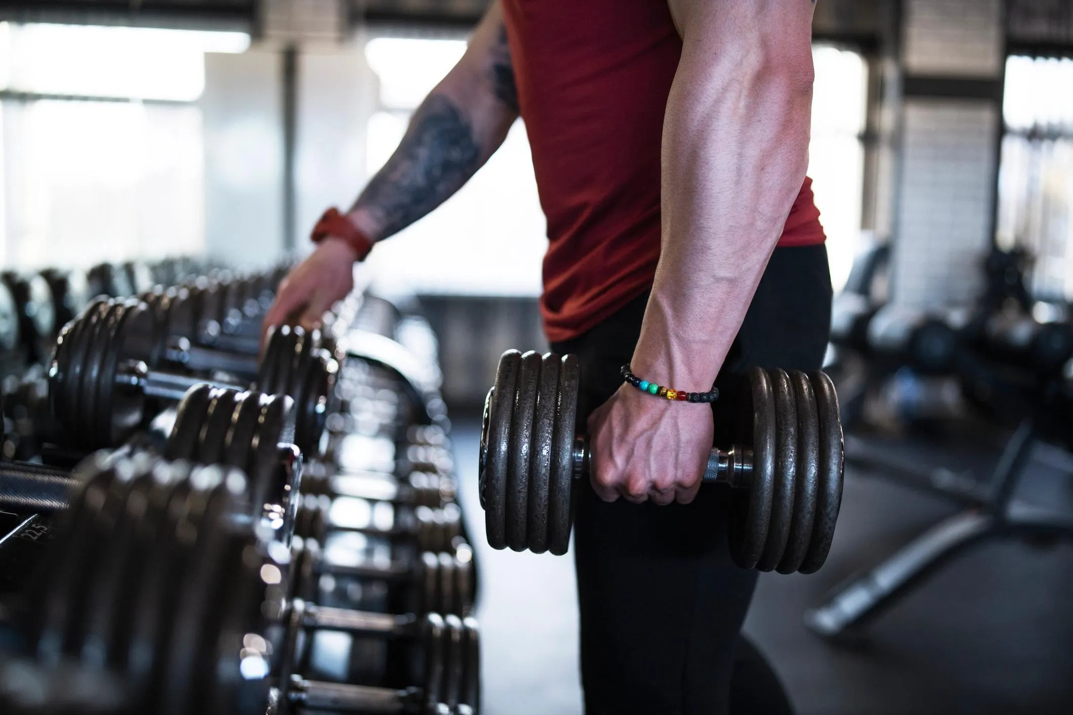 Person Holding Heavy Dumbbells Preparing For a Workout