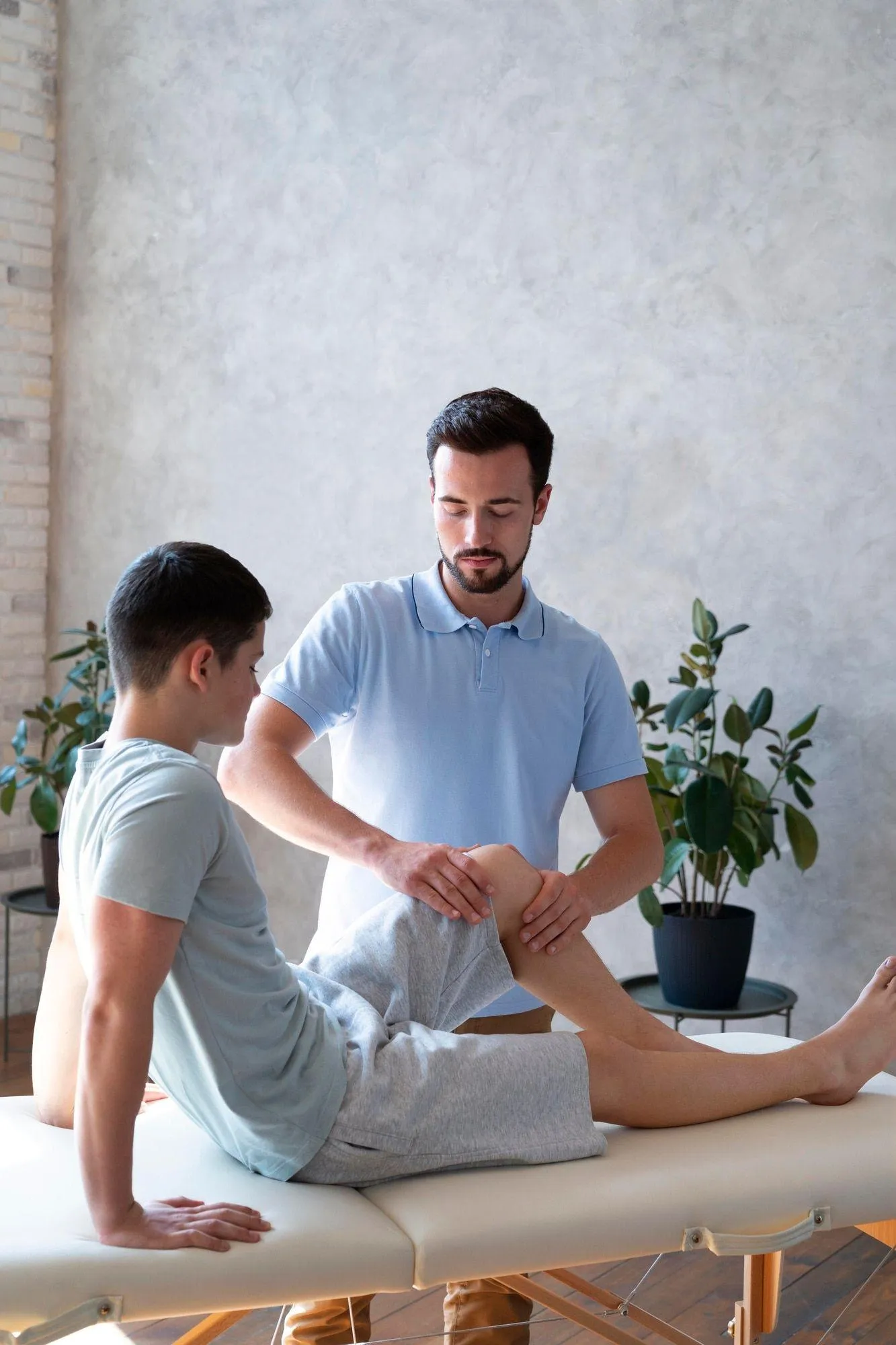 Physiotherapist Treating a Male Patient in a Clinic Image