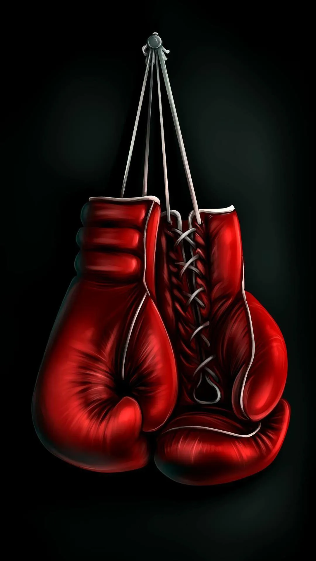 Red Boxing Gloves Hanging in a Dark Dramatic Background