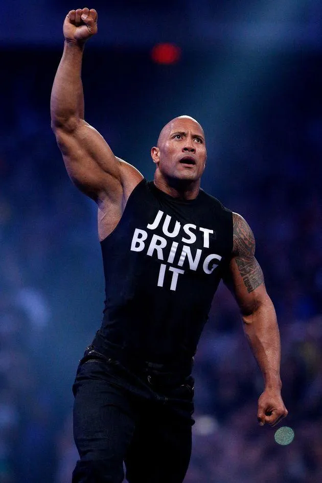 Rock Raising Fist Wearing Just Bring It Shirt Free Wallpaper