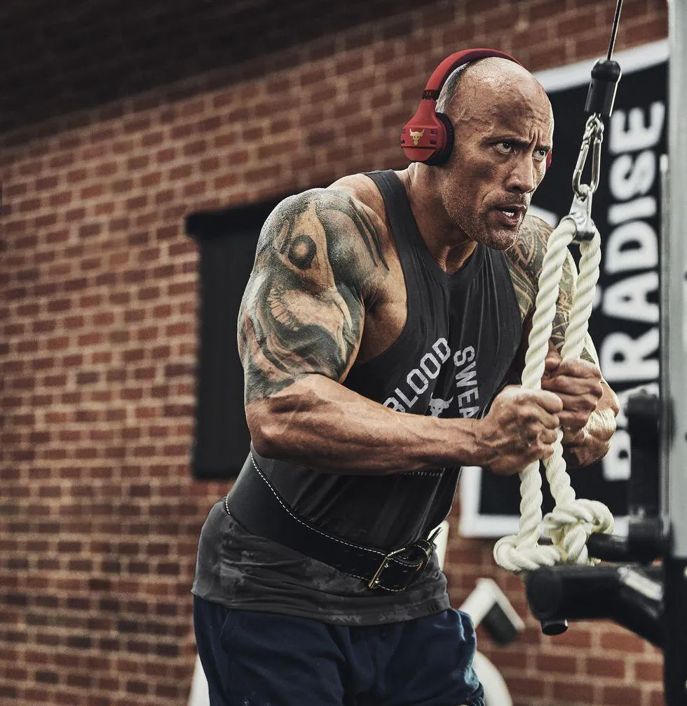 Rock Using Cable Machine With Headphones in Intense Workout