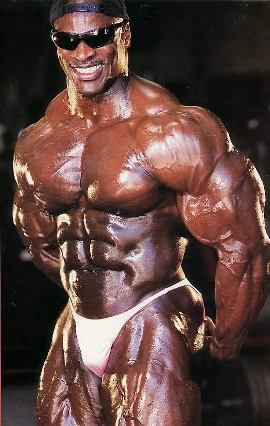 Smiling Professional Bodybuilder Posing in Competition