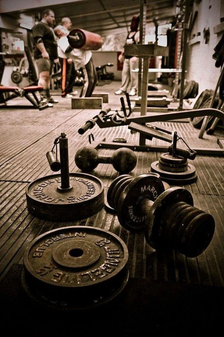 Vintage Style Photo of Gym Weights and Equipment on Floor