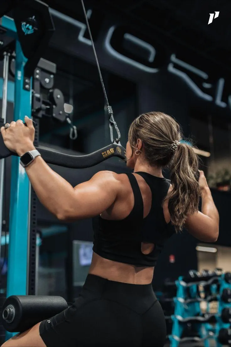 Woman Doing a Lat Pulldown Workout on a Fitness Machine
