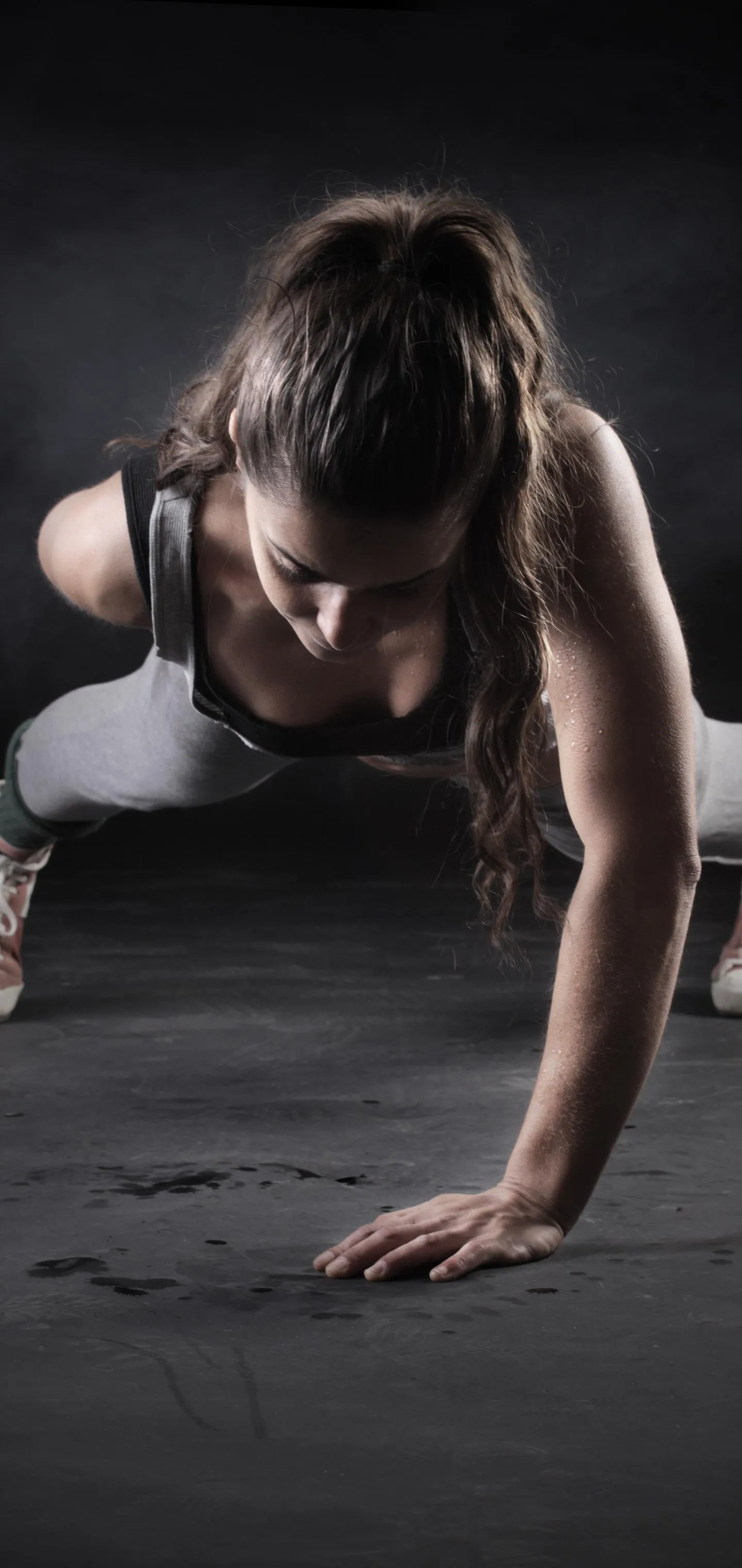 Woman Doing Plank Exercise on the Floor For Core Strength