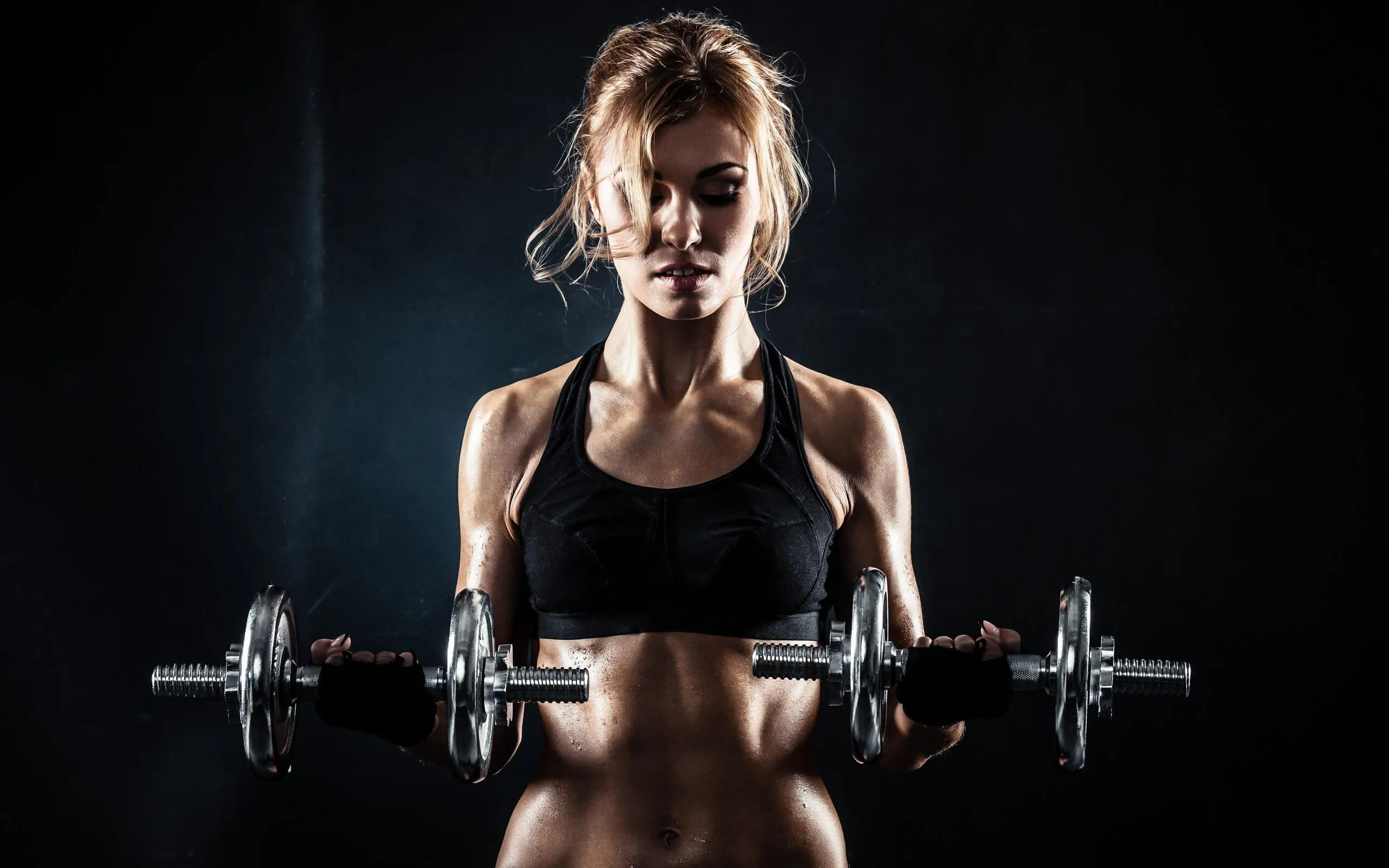Woman Lifting a Barbell Focusing on Strength and Muscle