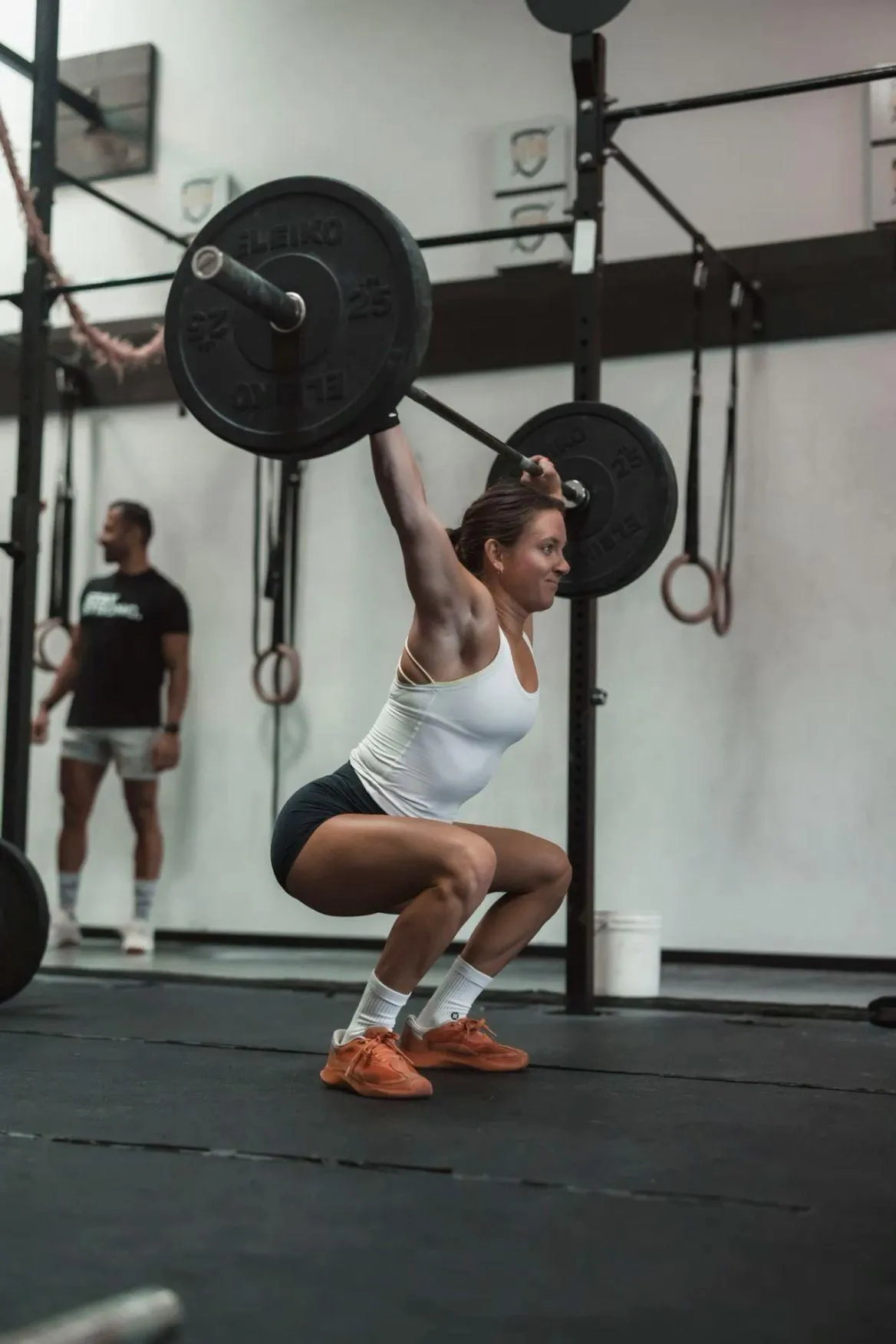 Woman Lifting Heavy Weights During an Intense Gym Workout