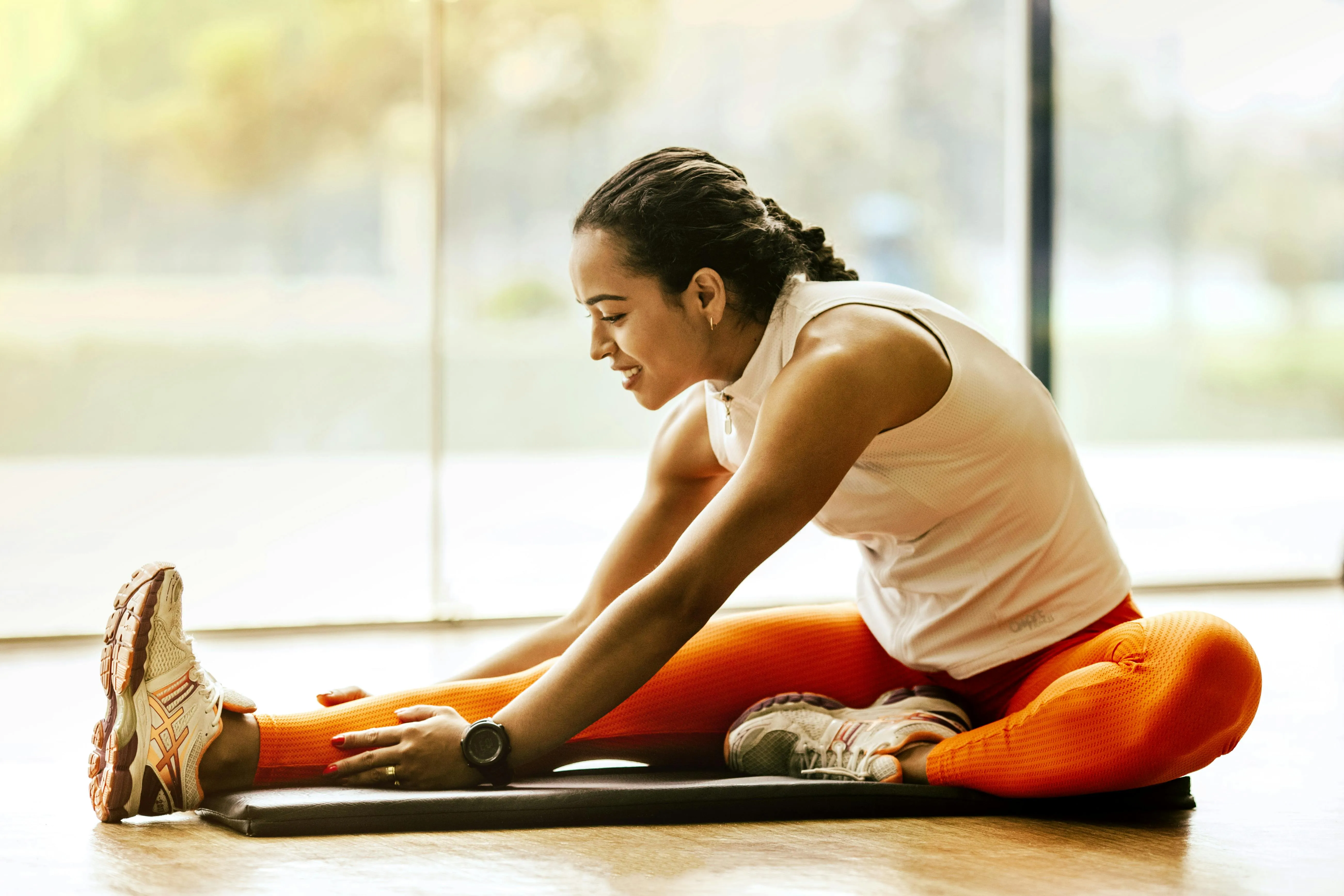 Woman Stretching Her Legs on the Floor Her Daily Workout