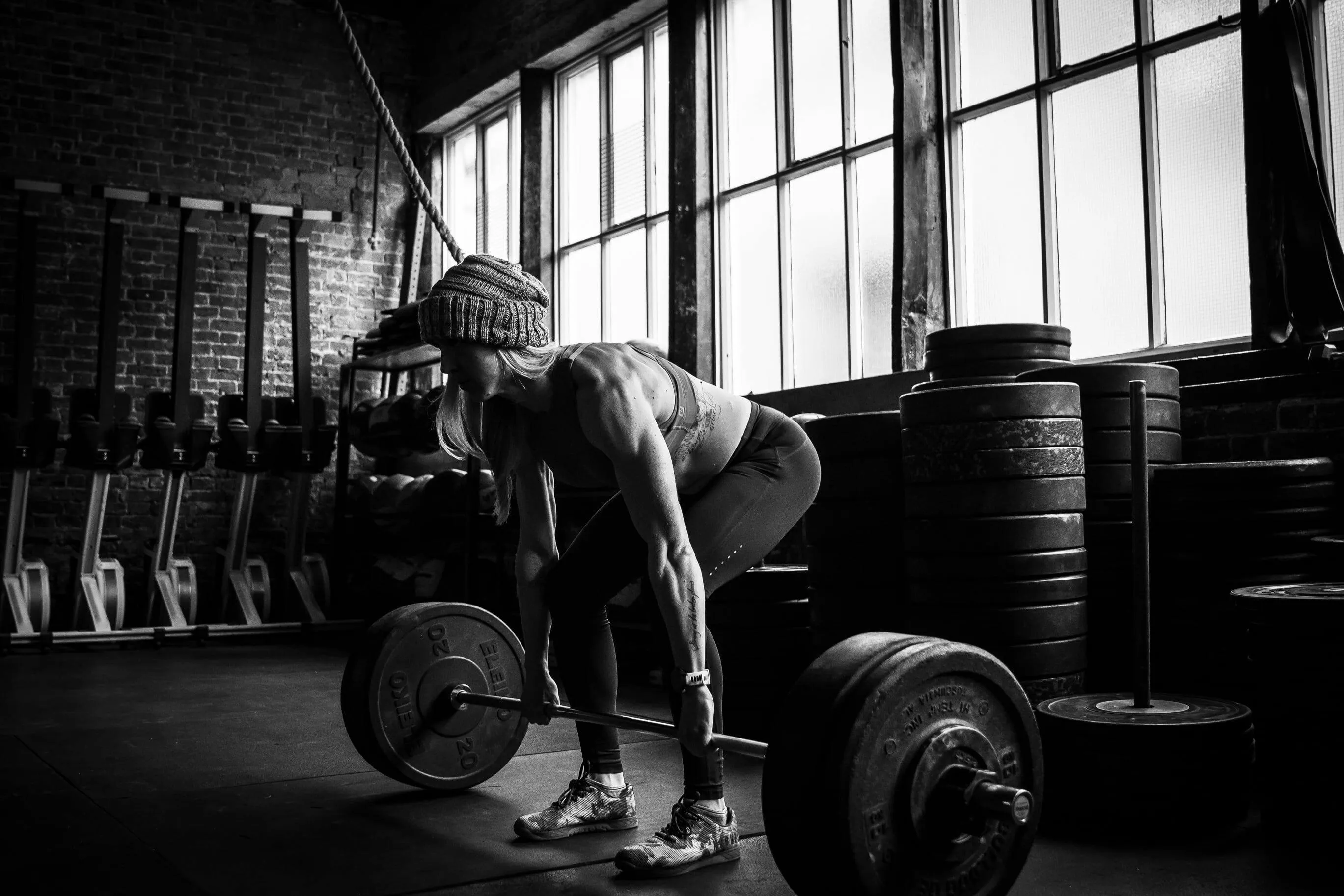 Women Preparing To Deadlift Heavy Weights in Gym Session