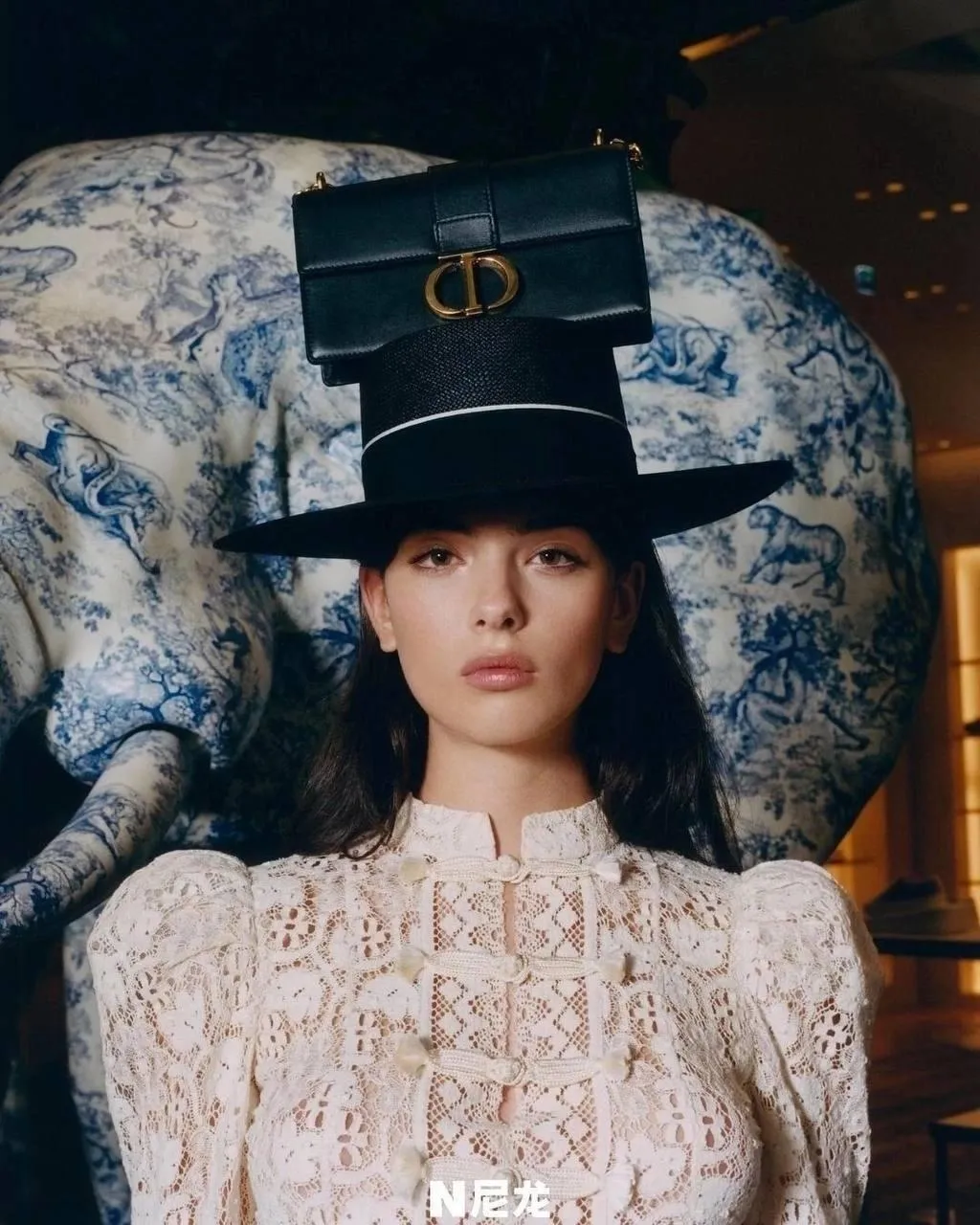 Artistic Model in a White Dress with a Tall Black Top Hat