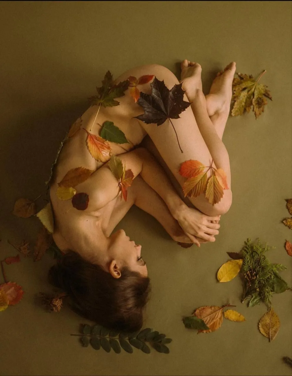 Artistic Nude in Water with Flowers in a Surreal Composition