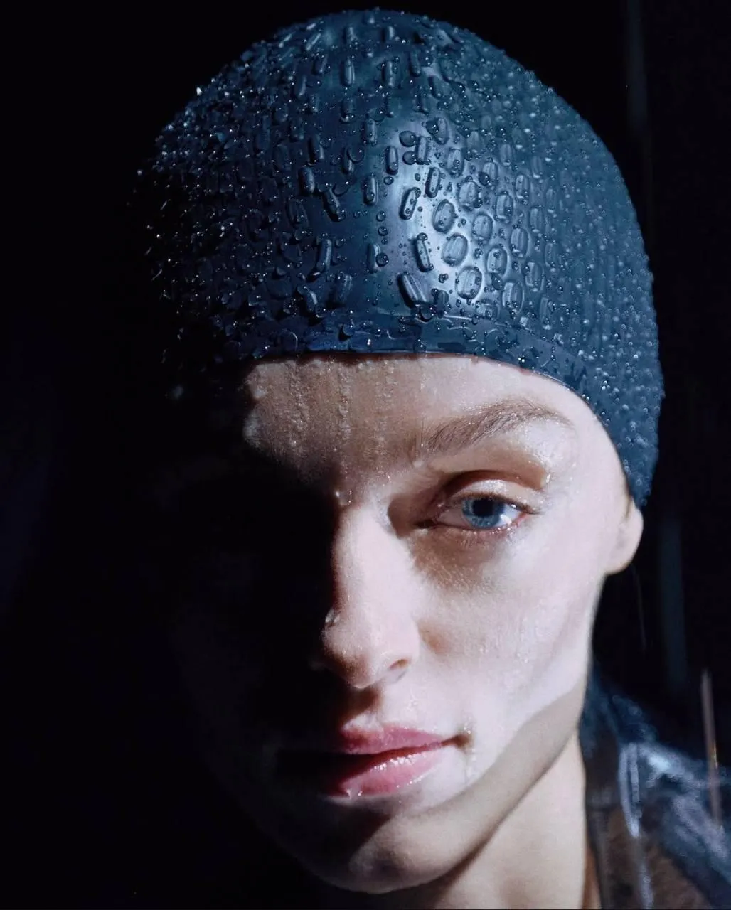 Artistic Portrait of a Woman in a Dramatic Swim Cap Lighting