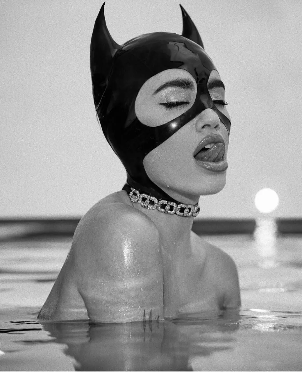 Artistic Woman in a Cat Mask Emerging From the Ocean Waters