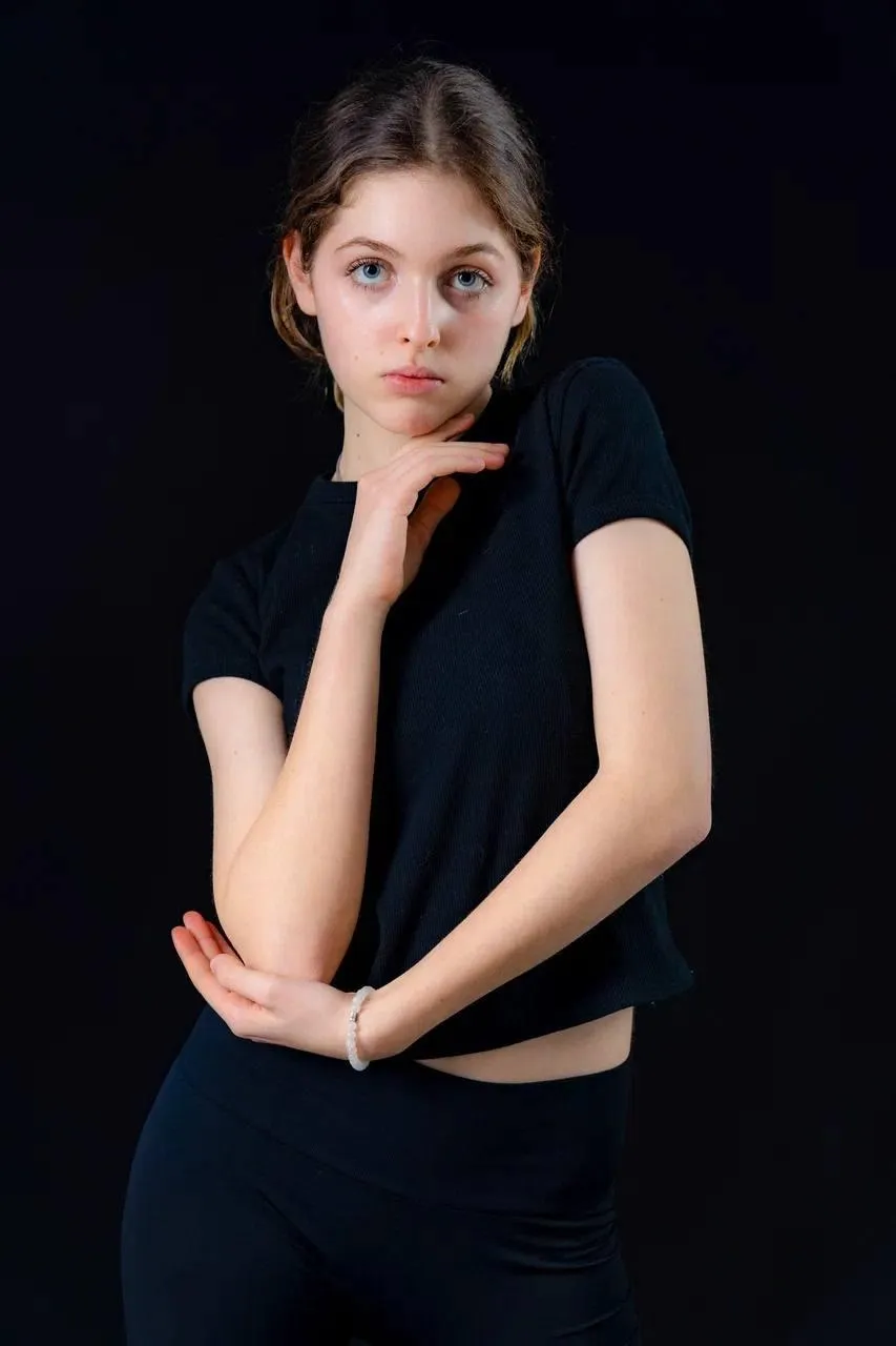 Beautiful girl with a black outfit and looking intensely